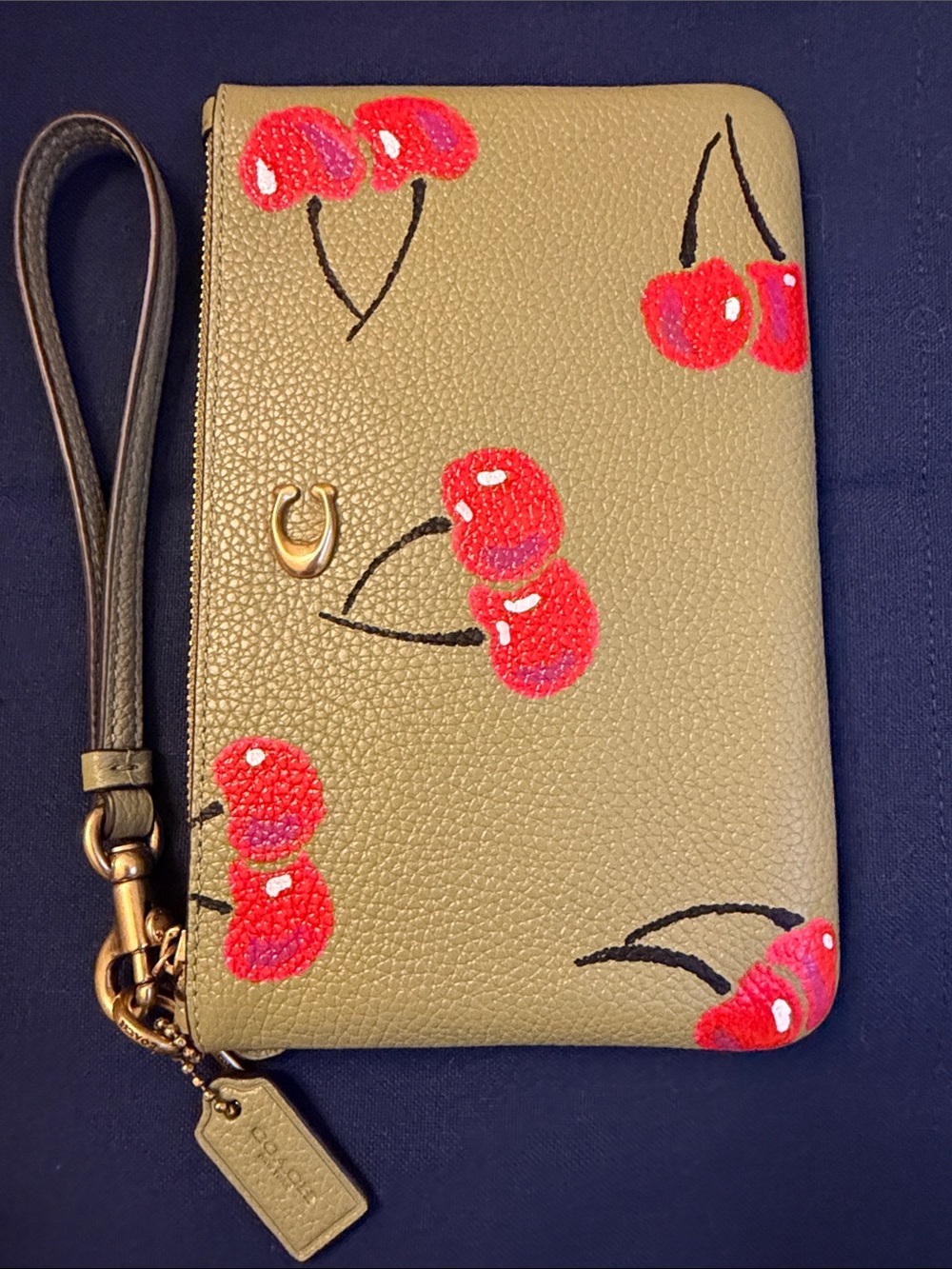 Coach Olive Green Leather Wristlet with painted Red Cherries by a local artist.